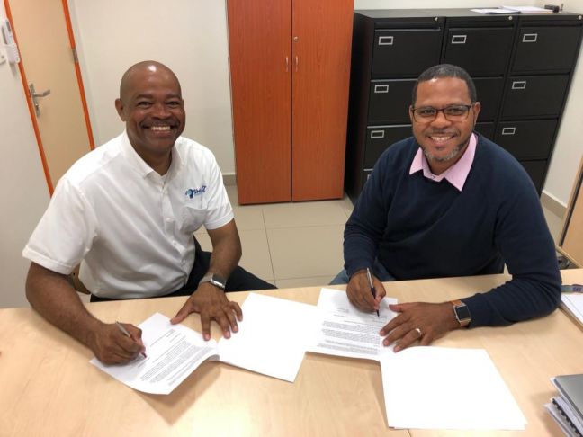 Smart Concepts 721 CEO Michael Jeffrey on the left and NIPA&#039;s Director Sergio Blomont on the right signing the MoU. 